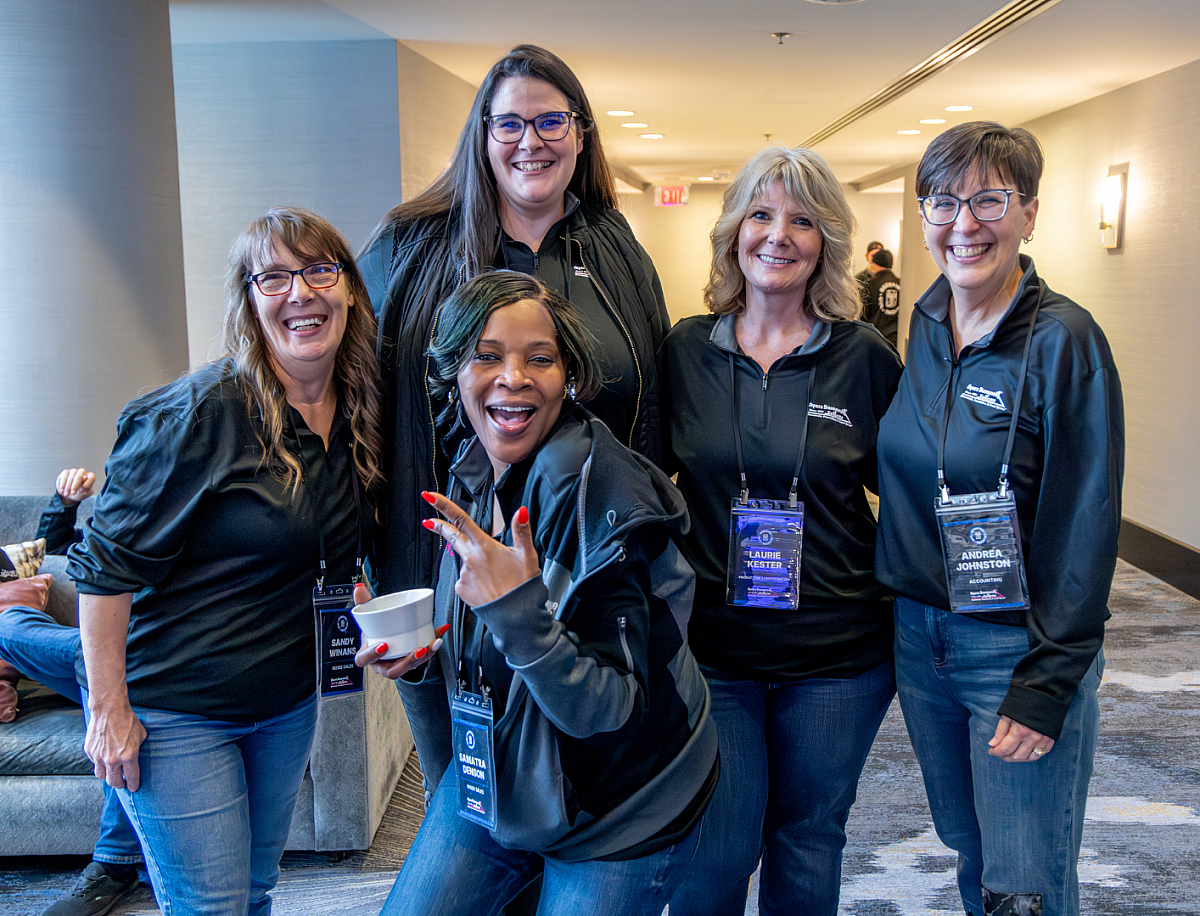 ayers-office-staff-smiling-together-at-company-event-2026