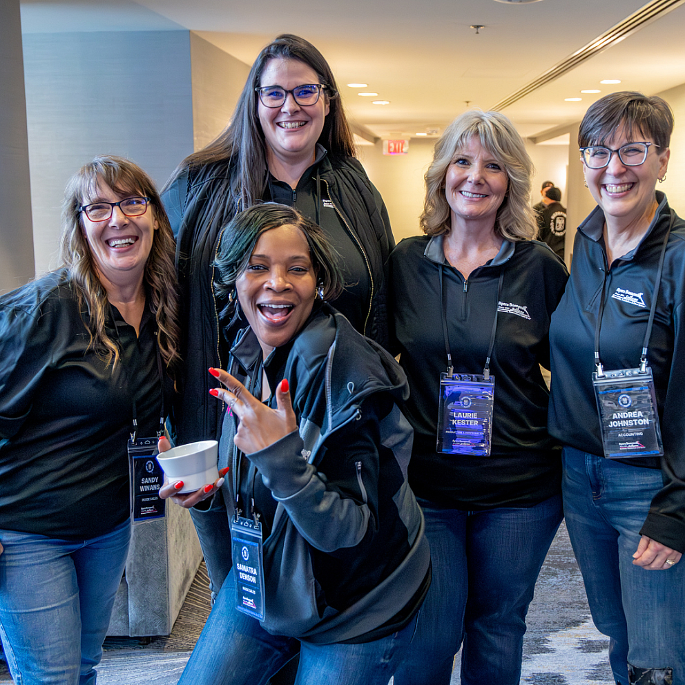 ayers-office-staff-smiling-together-at-company-event-2026