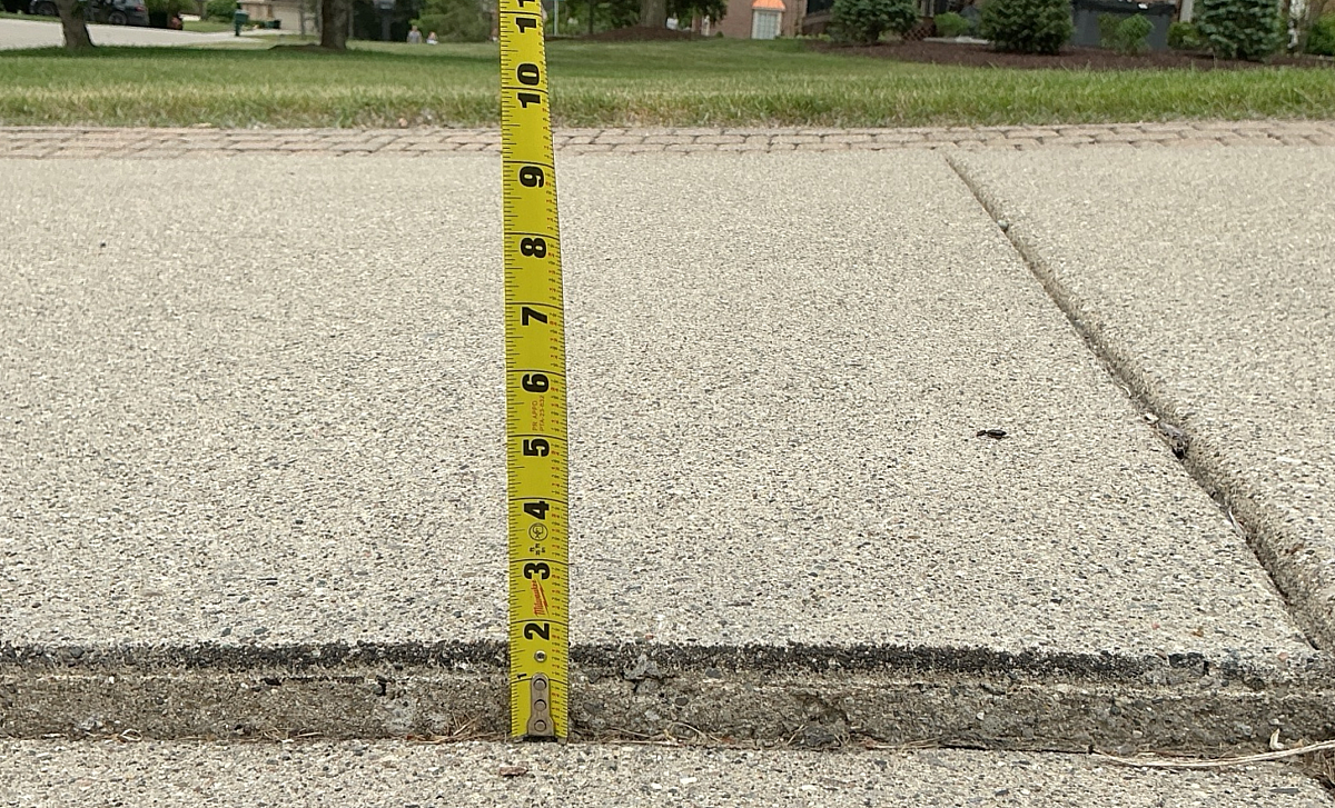 Before you replace your concrete driveway consider repair